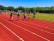 Bild von Schüler*innen bei einem Laufwettbewerb.